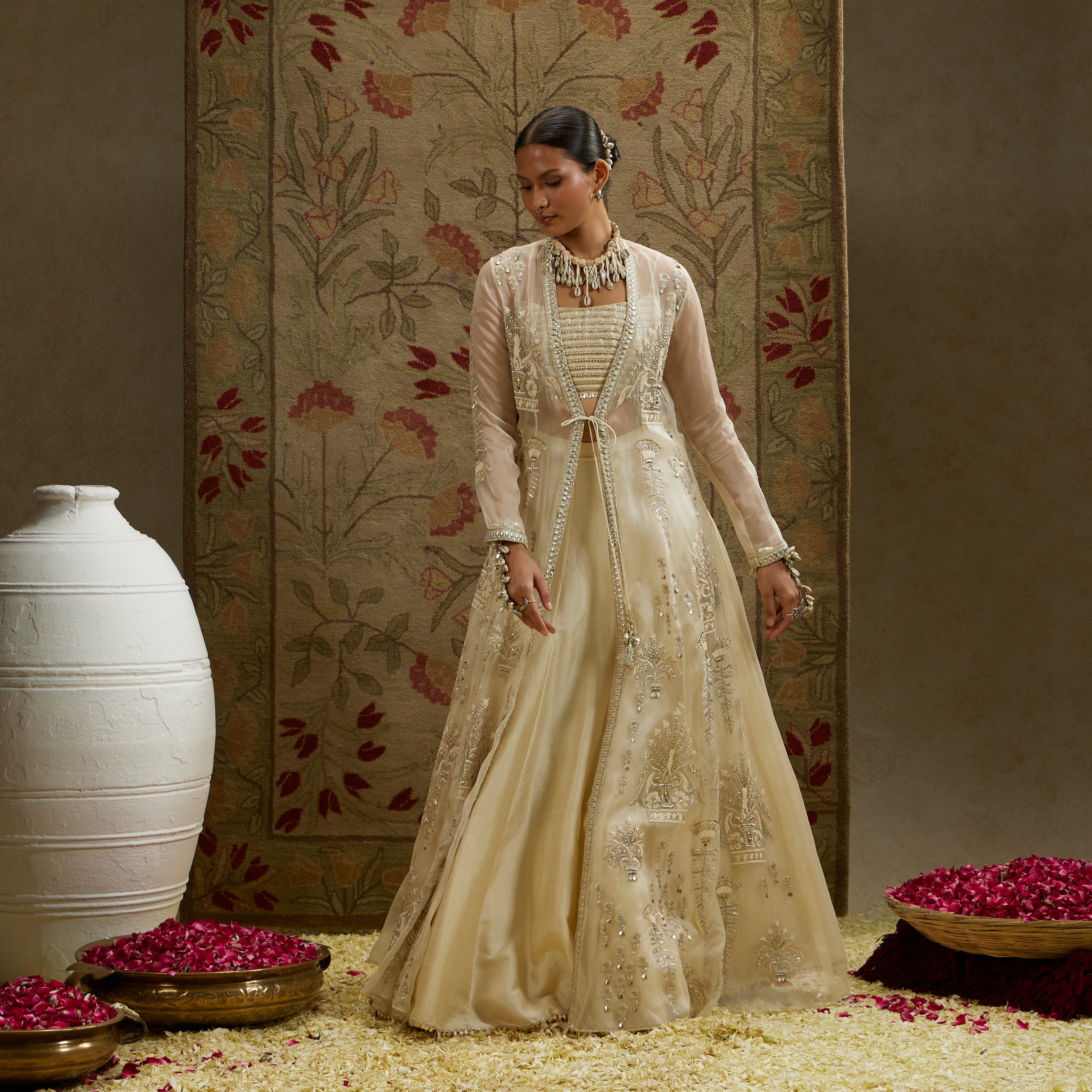 Magnolia Organza Embellished Jacket Paired With Metal Bustier And Lehenga