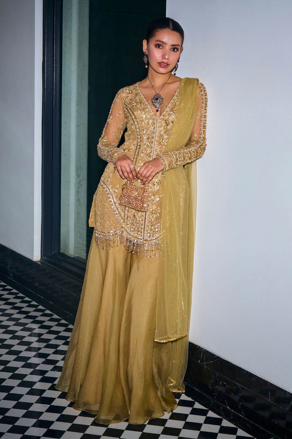 Gold Tonal Embroidered Kurta And Sharara Set