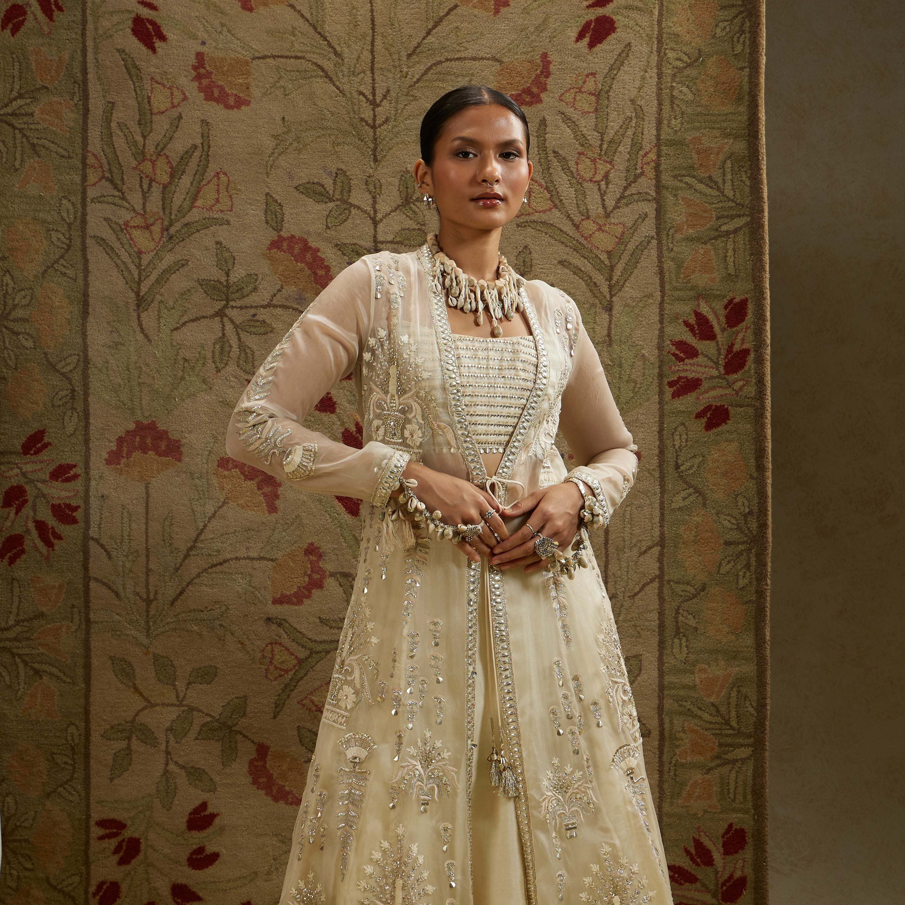 Magnolia Organza Embellished Jacket Paired With Metal Bustier And Lehenga