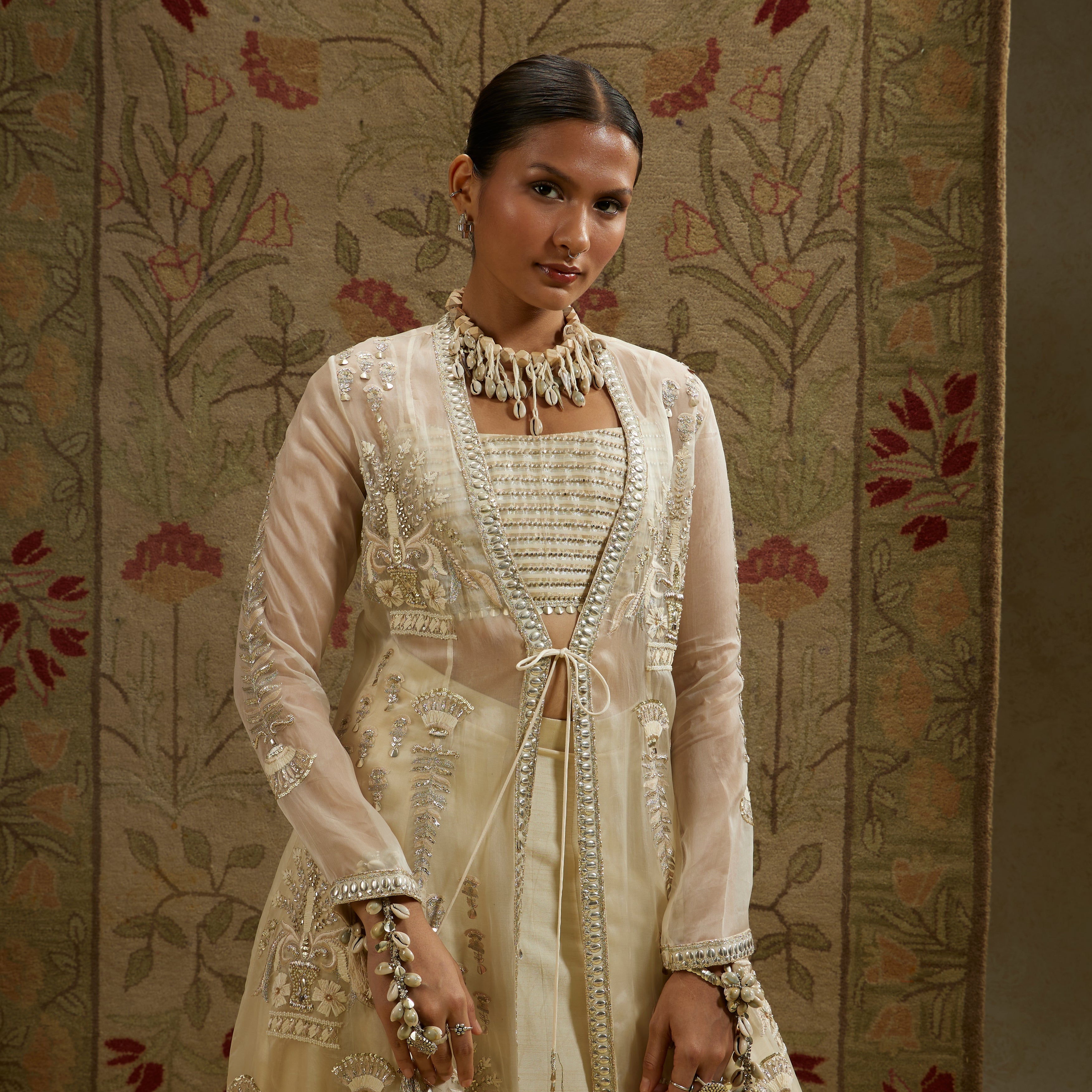 Magnolia Organza Embellished Jacket Paired With Metal Bustier And Lehenga