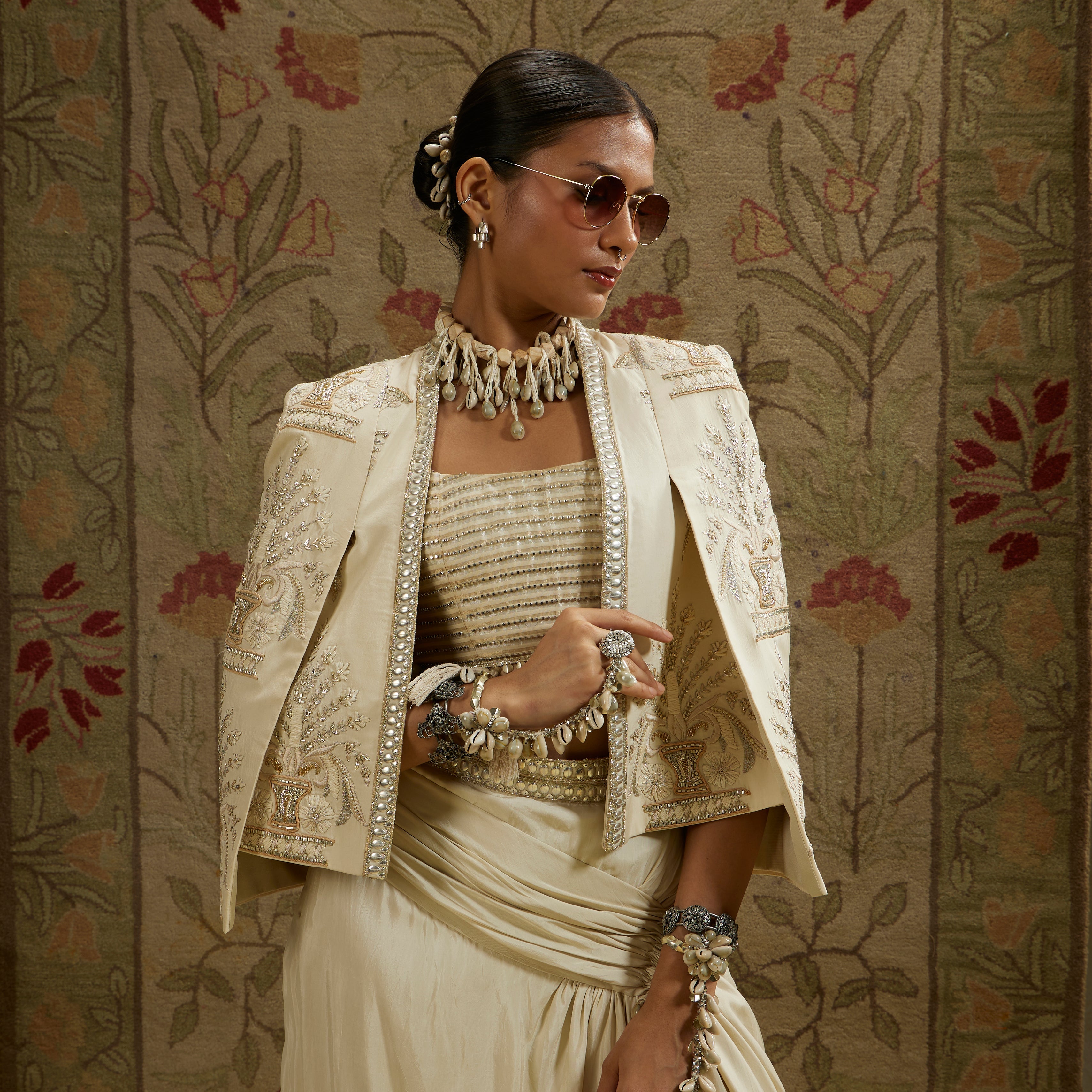 Magnolia Embellished Butta Cape Jacket Paired With Metal Embellished Bustier And Slit Skirt