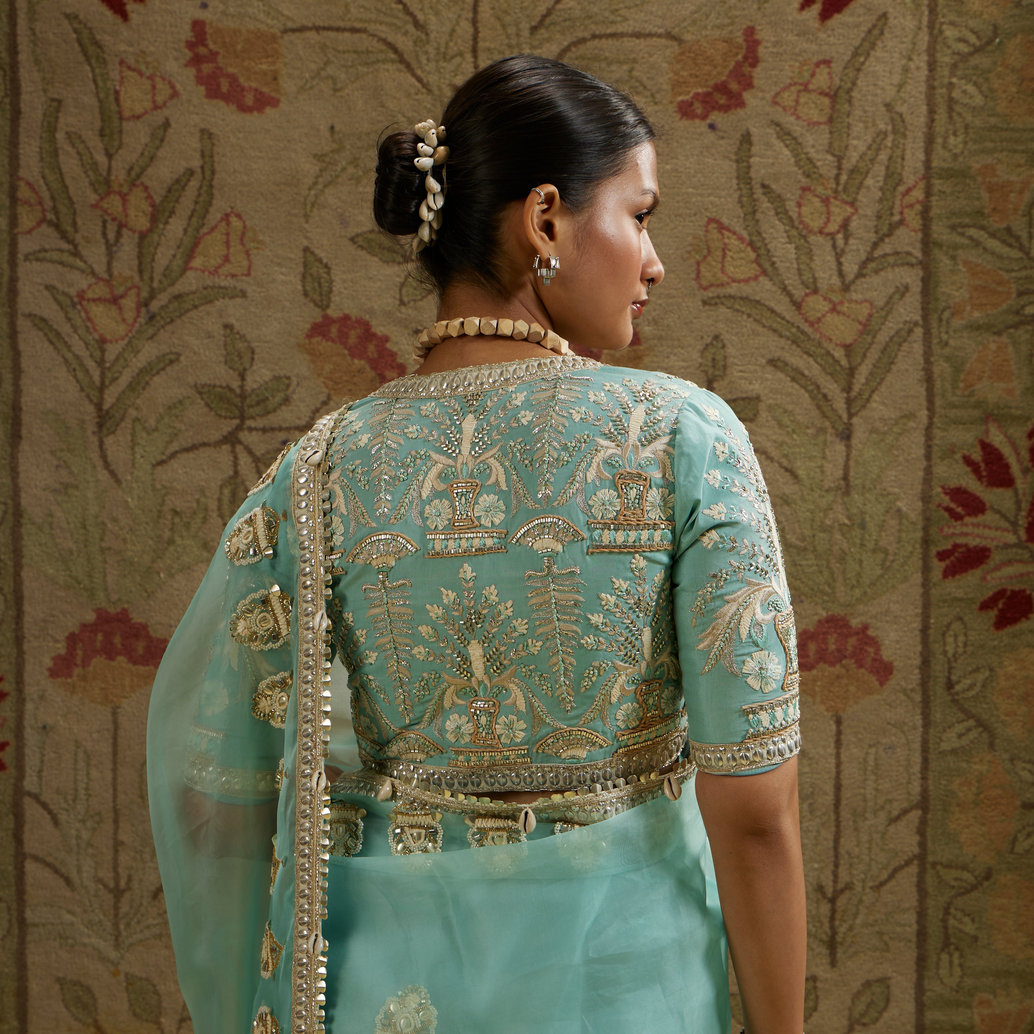 Teal Blue Organza Embellished Saree Paired With Embellished Blouse