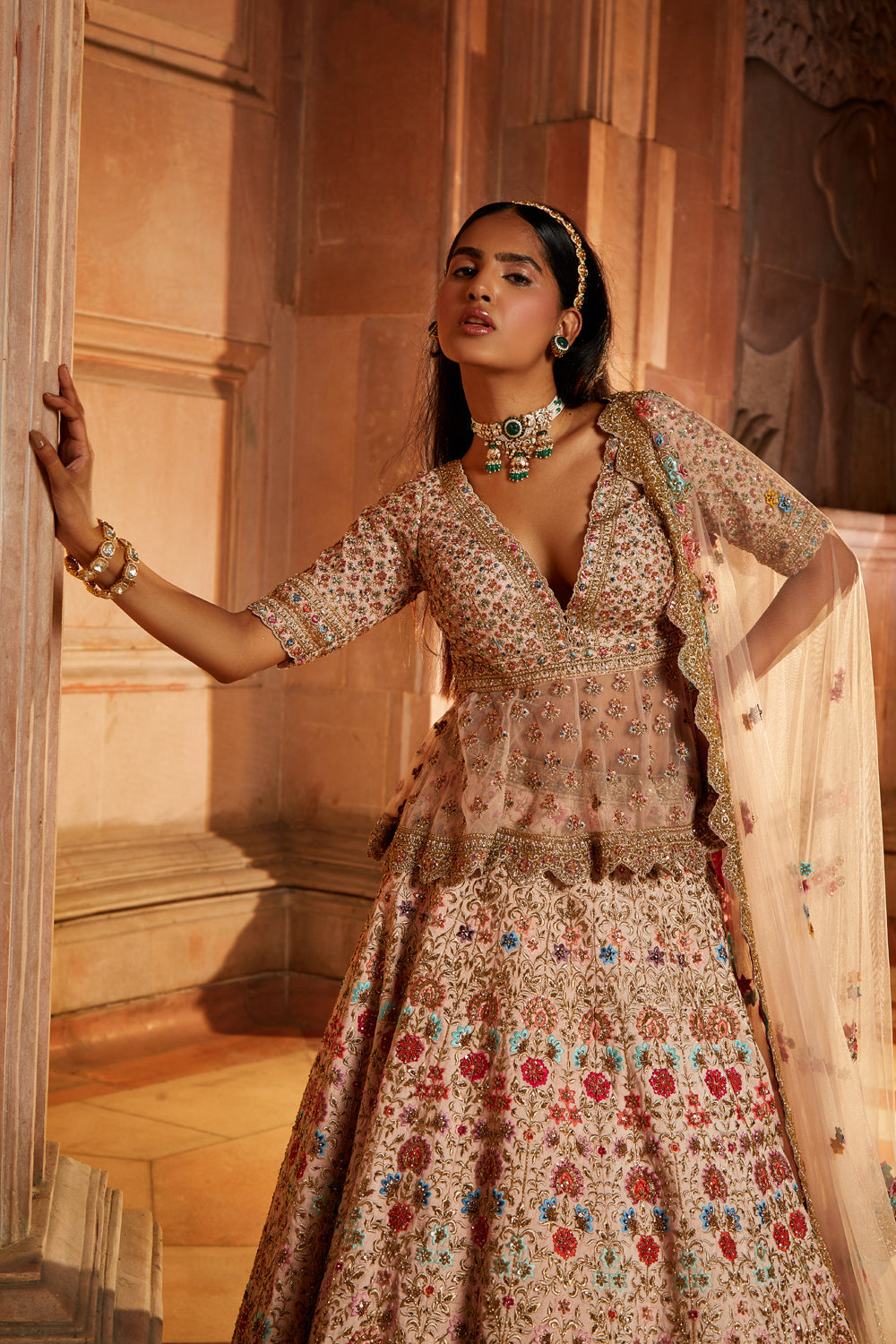 Blush Pink Raw Silk Lehenga With A Peplum Top And Tulle Dupatta