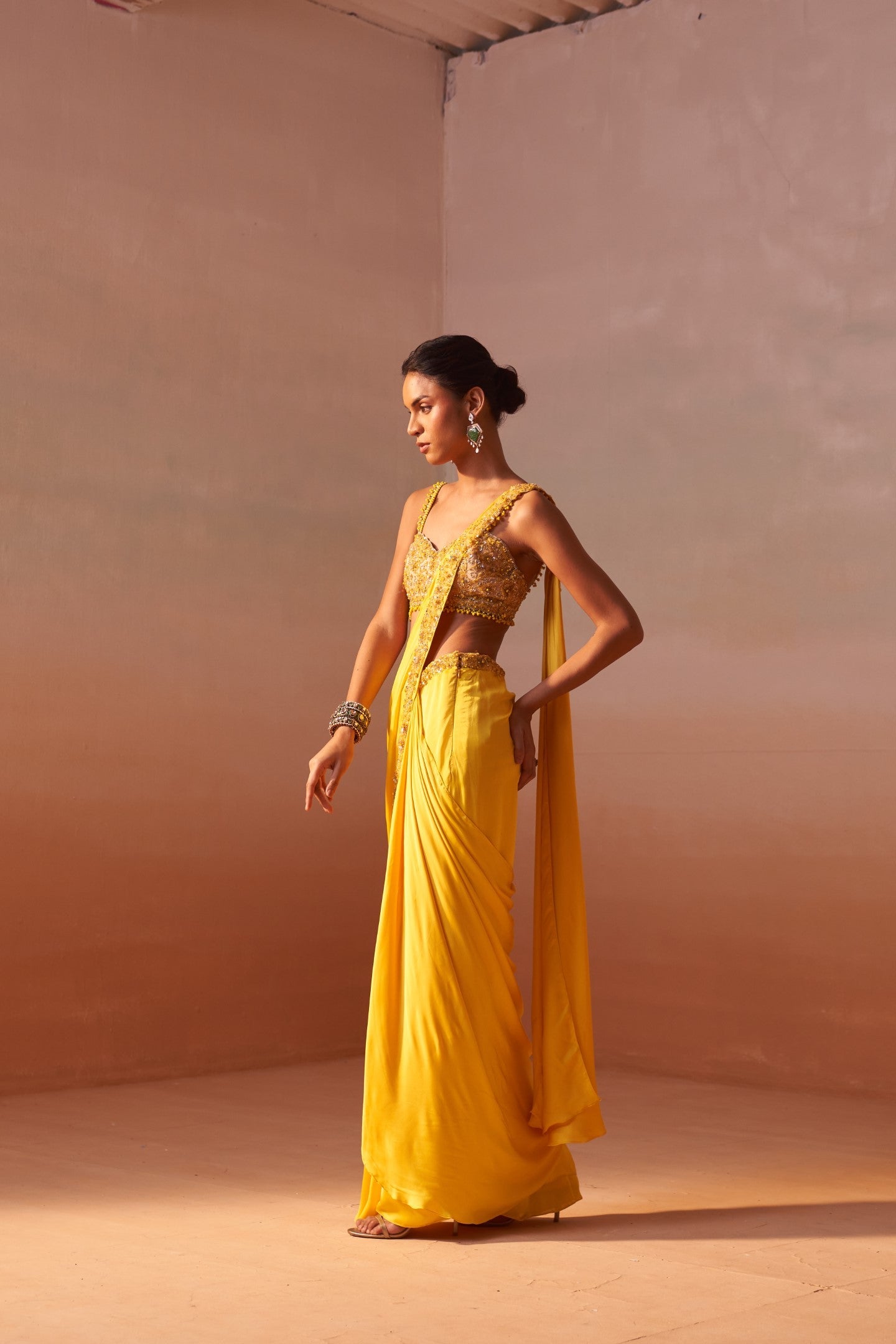 Yellow Draped Saree With Nude Choli