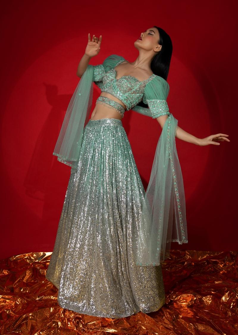 Aqua Green Ombre Sequins Lehenga With Hand Embroidered Choli Featuring Half Puffed Sleeves