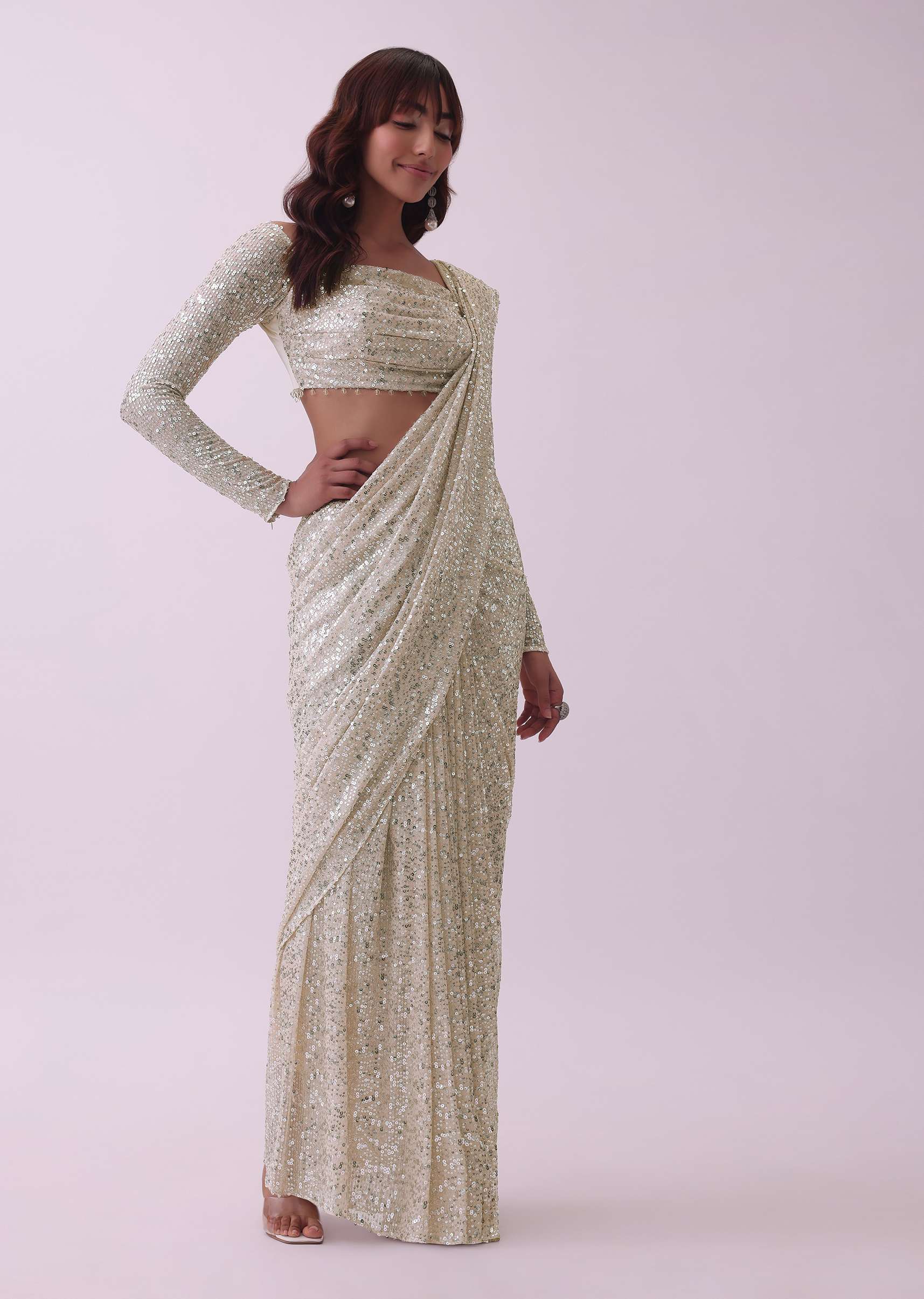 Off-White Sequins Saree And Blouse With Cowl Sleeves And Tassels