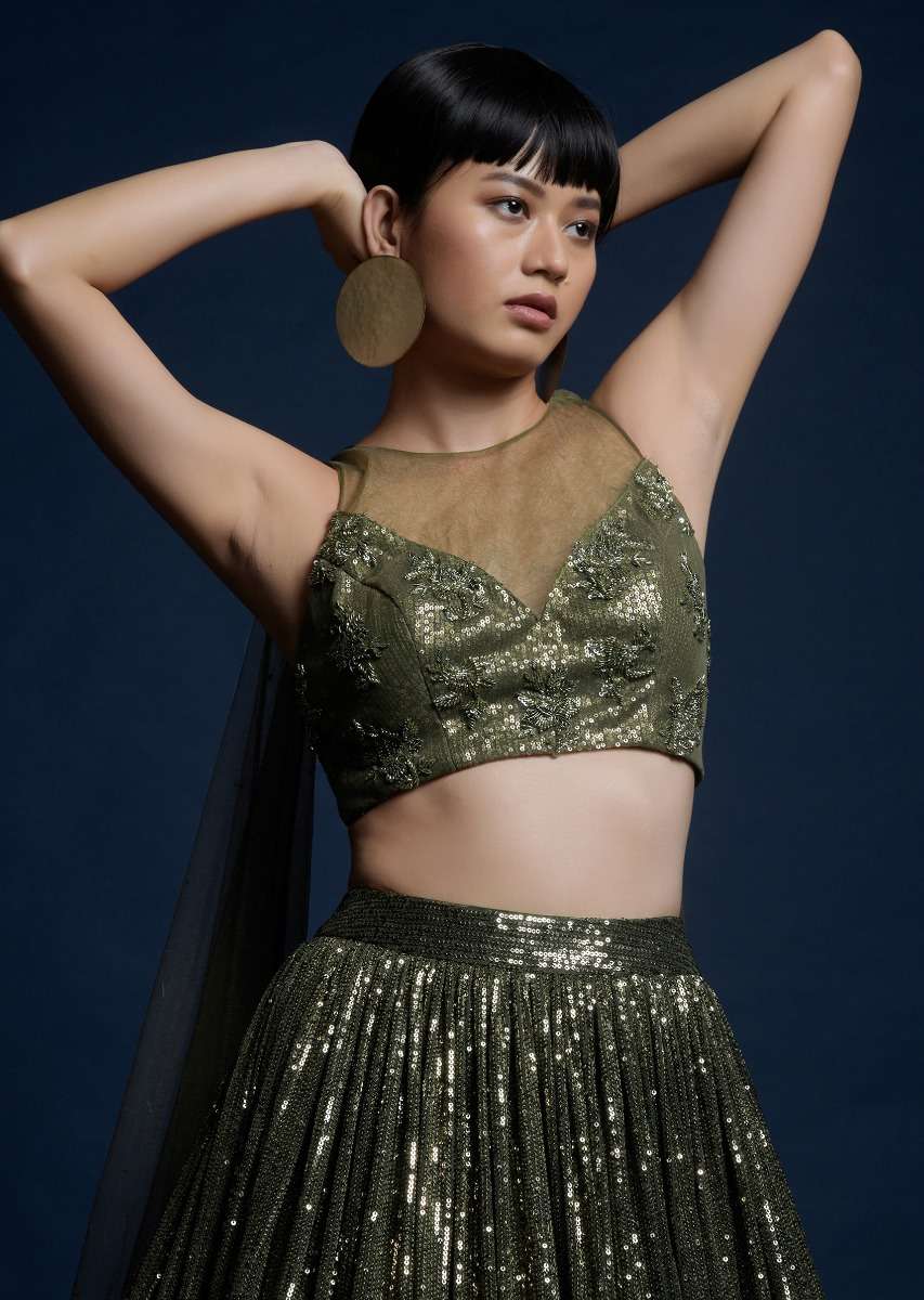 Olive Green Lehenga Embellished In Sequins And Cut Dana Embellished Crop Top With Attached Net Cape