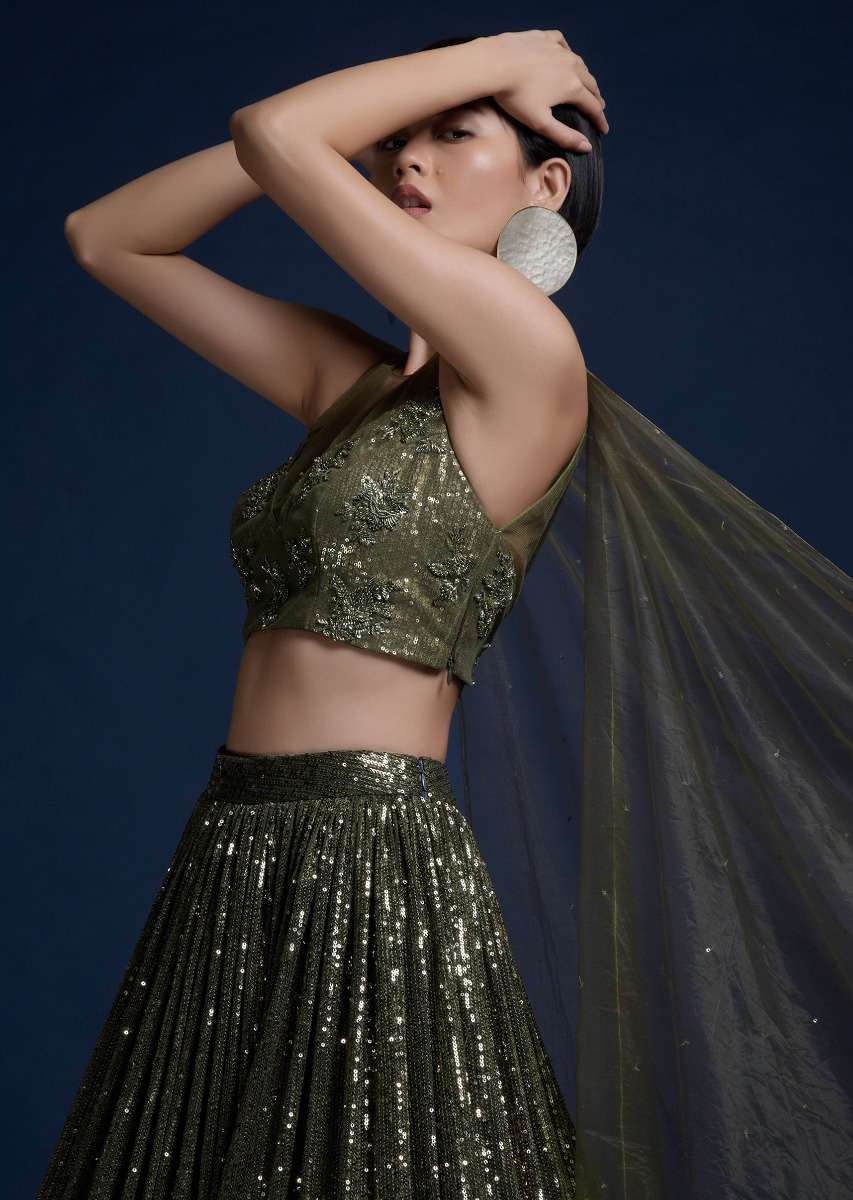 Olive Green Lehenga Embellished In Sequins And Cut Dana Embellished Crop Top With Attached Net Cape
