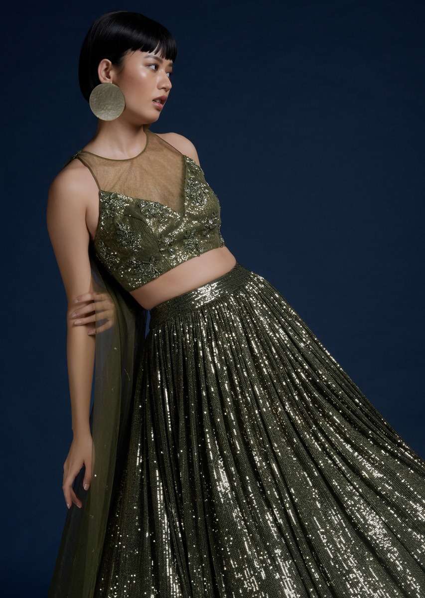 Olive Green Lehenga Embellished In Sequins And Cut Dana Embellished Crop Top With Attached Net Cape