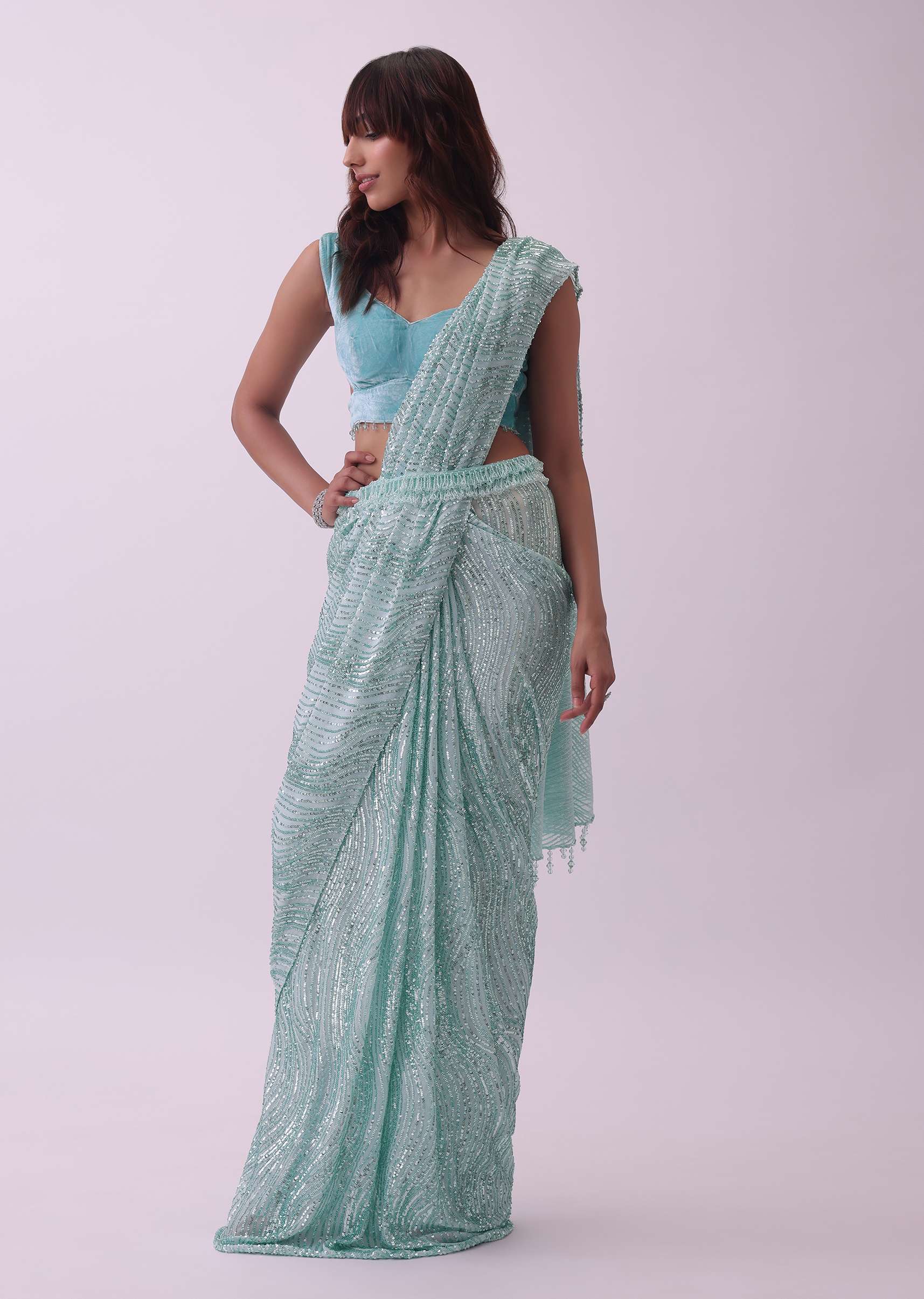 Aqua Blue Saree And Stitched Velvet Blouse With Hanging Crystals